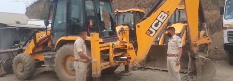 Police inspecting the site where suspected militants tirggered a powerful  IED at Waithou Bazar of Thoubal district on Saturday night.